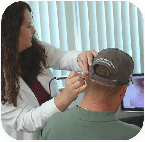 Dr. Jessica Woods performing a hearing test